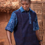 2- tone, short- sleeved shirt with collar, buttons at neck, pocket