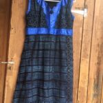 Short, sleeveless a-line dress, sculpted v-neck inlay, high waistband